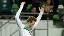 Pemain Wolfsburg, Andre Schuerrle merayakan golnya ke gawang KAA Gent pada leg kedua babak 16 besar Liga Champion di di Volkswagen Arena, Wolfsburg, Rabu (9/3/2016) dini hari WIB. (AFP/John Macdougall)