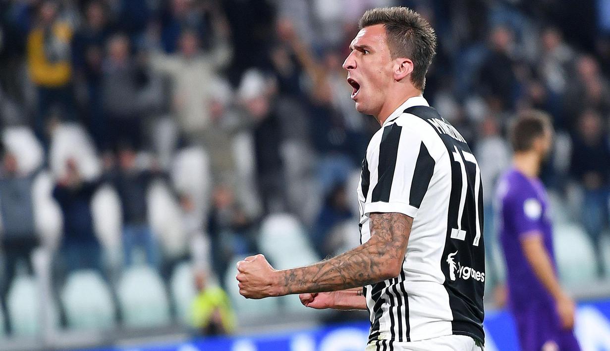 Mario Mandzukic mencetak satu gol untuk Juventus saat melawan Olympiakos pada laga grup D Liga Champions di Allianz stadium, Turin, (27/9/2017). Juventus menang 2-0. (Alessandro Di Marco/ANSA via AP)