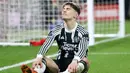 Ekspresi pemain Manchester United, Alejandro Garnacho, setelah ditaklukkan Nottingham Forest pada laga pekan ke-20 Premier League 2023/2024, Minggu (31/12/2023) dini hari WIB. (AFP/Darren Staples)