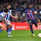 Barcelona&nbsp;membungkam&nbsp;Real Sociedad dengan skor 1-0 pada laga perempat final Copa del Rey di Camp Nou, Kamis (26/1/2023) dini hari WIB. Gol tunggal kemenangan Barca dicetak Ousmane Dembele. (AFP/Pau Barrena)