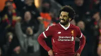 Mohamed Salah memborong dua gol saat Liverpool ditahan Tottenham Hotspur 2-2. (Paul ELLIS / AFP)