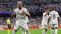 Real Madrid meraih kemenangan 3-0 atas&nbsp;Real Valladolid pada laga pekan kedua La Liga di Santiago Bernabeu, Minggu (25/8/2024) malam WIB. Gol tunggal kemenangan Madrid dicetak Federico Valverde. (AFP/Pierre-Philippe MARCOU)