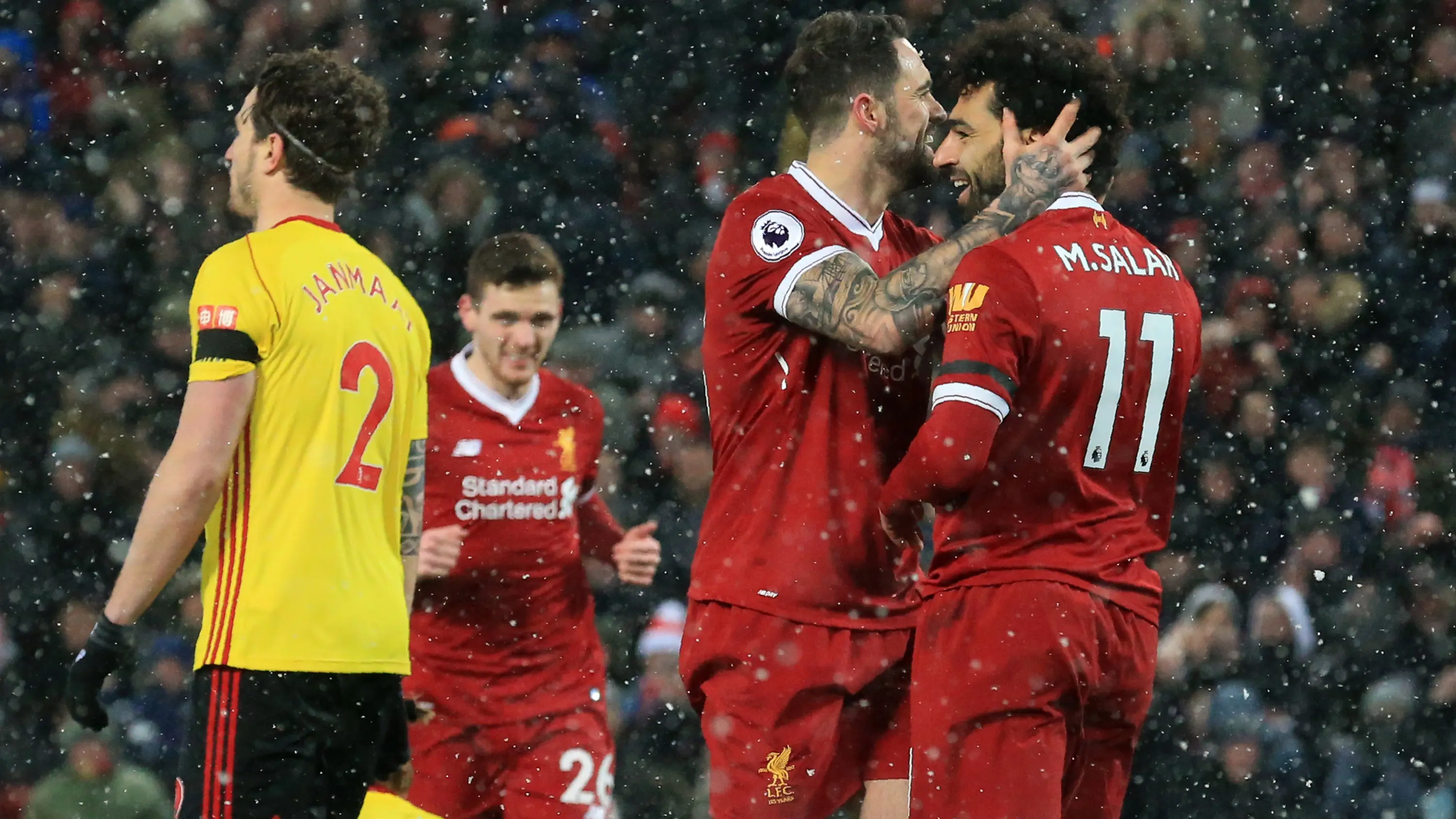 Pemain Liverpool merayakan gol yang dicetak Mohamed Salah ke gawang Watford pada laga Premier League di Stadion Anfield, Liverpool, Sabtu (17/3/2018) (AFP/Lindsey Parnaby)