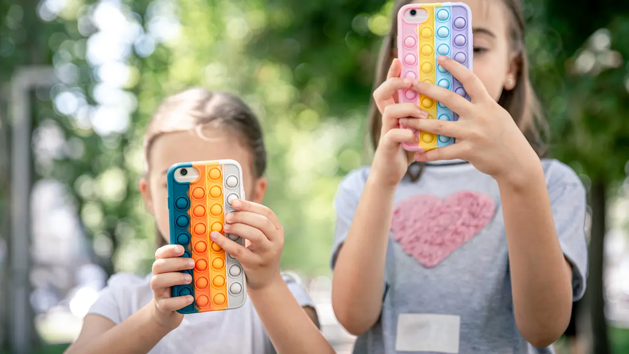 Kids playing with their gadget