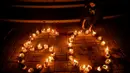Earth Hour sangat berkaitan dengan penghematan energi secara berkesinambungan. (JUNI KRISWANTO/AFP)
