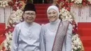 <p>Menteri Tenaga Kerja RI, Ida Fauziah tampil mengenakan baju adat melayu, dengan atasan baju kurung warna silver dipadukan kain dan selendeng kain songket yang serasi. @idafauziahnu</p>