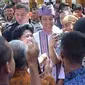 Presiden Joko Widodo mengenakan baju adat Toraja dan ikat kepala Passapu saat menghadiri Festival Lovely December 2018. (dok. Instagram @jokowi/Dinny Mutiah)