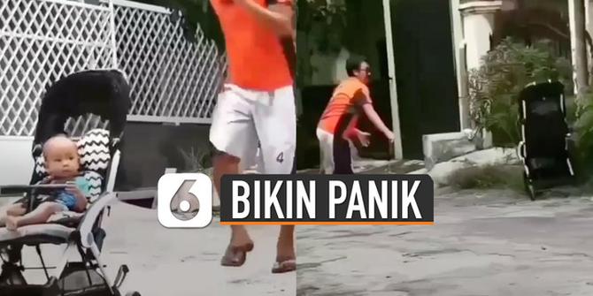 VIDEO: Panik, Pria Bermain Dengan Anaknya di Dorongan Bayi Endingnya Bikin Kaget