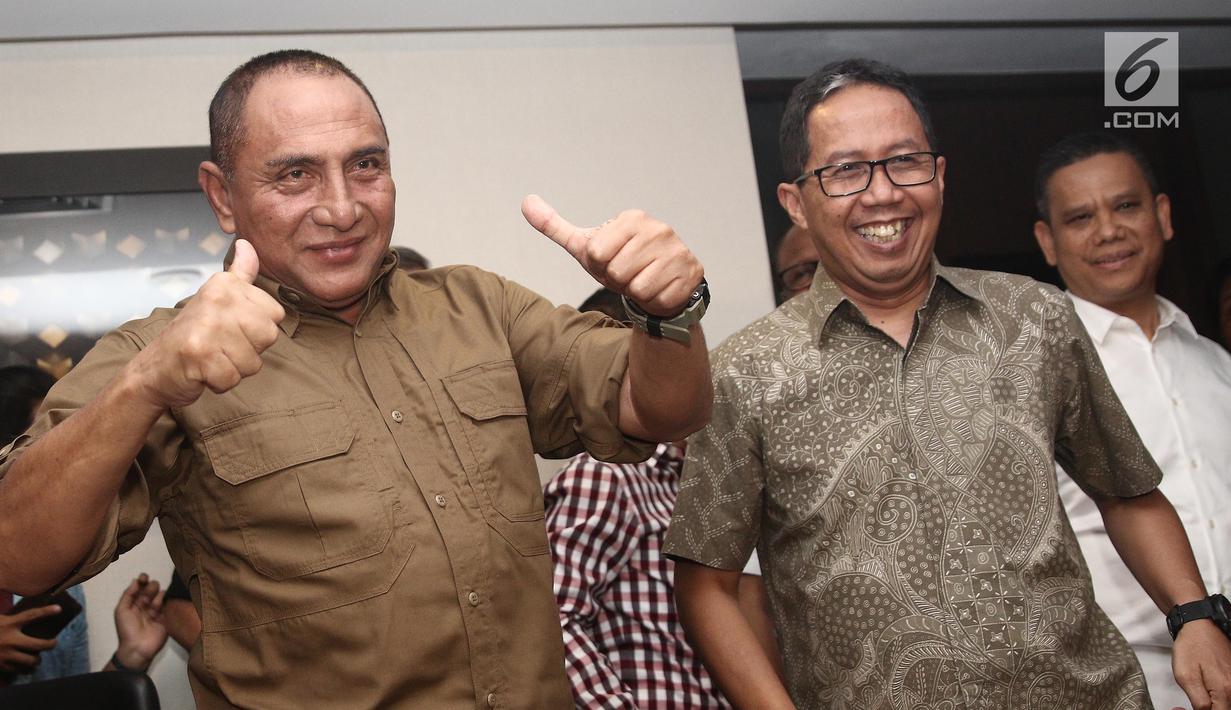 Ketua Umum PSSI Edy Rahmayadi dan Wakil Ketua Joko Driyono usai jumpa pers terkait meninggalnya suporter Persija, Haringga Sirila, di Jakarta, Selasa (25/9). PSSI secara resmi menghentikan sementara waktu Liga 1 2018. (Liputan6.com/Herman Zakharia)