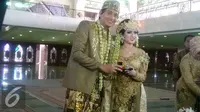 Lucky Hakim dan Tiara Dewi alias Syahrini KW resmi menjadi suami-istri. (Rizky Aditya Saputra/Liputan6.com)