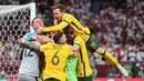 Timnas Australia berhasil meraih tiket ke putaran final Piala Dunia 2022, setelah meraih kemenangan dramatis atas Peru. Dengan lolosnya Australia, kini sudah ada 31 tim yang lolos ke Qatar. (AFP/Karim Jaafar)