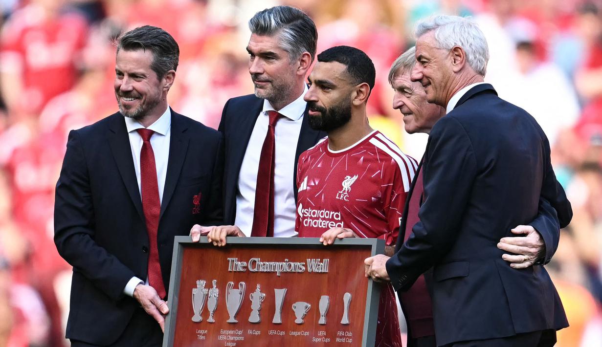 Sejauh ini, Salah telah mempersembahkan sembilan trofi untuk Liverpool, salah satunya dua gelar Liga Inggris dan satu trofi Liga Champions. (AFP/Paul Ellis)