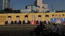 Mural bergambar sejumlah Presiden Indonesia terpampang di tembok jembatan flyover di depan kampus Trisakti , Jakarta, Selasa (12/5/2015). Hingga kini pelaku dan dalang peristiwa 12 Mei 1998 belum terungkap. (Liputan6.com/Johan Tallo)