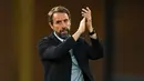 Catatan terbaik Gareth Southgate saat menukangi Timnas Inggris adalah mencapai semifinal Piala Dunia 2018 dan runner up Euro 2020. Dengan banyaknya pemain bintang di Skuad The Three Lions, ia diharapkan mampu berbicara lebih di Piala Dunia 2022 Qatar nanti. Southgate diketahui merupakan salah satu pelatih dengan gaji paling mahal di perhelatan terbesar di dunia itu. Ia tercatat menerima upah sebesar 4,9 juta pound per tahun. (AFP/Paul Ellis)