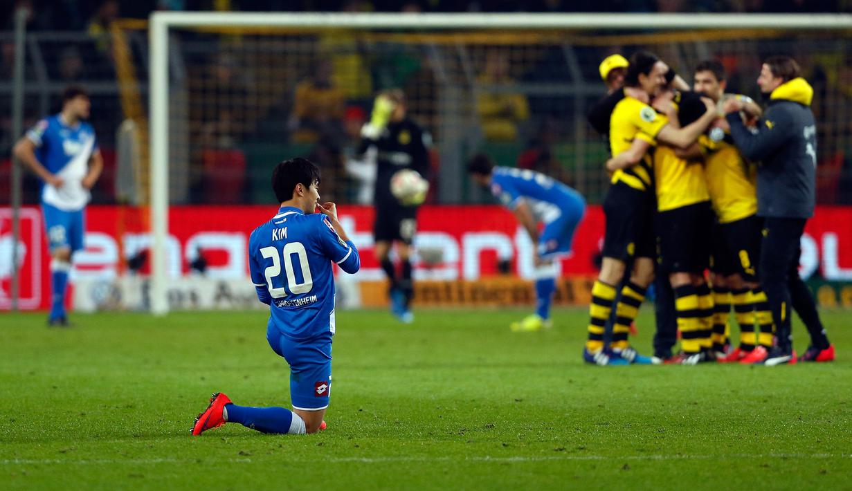 Terekam jelas perbedaan ekspresi penggawa Borussia Dortmund dengan Hoffenheim.