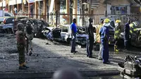 Serangan bom mobil di Abuja, Nigeria. (Afolabi Sotunde/Reuters)