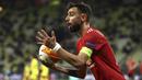 Bruno Fernandes. Gelandang Manchester United berusia 26 tahun ini sukses menyumbang 28 gol di semua ajang kompetisi musim ini. Merupakan pembelian tersukses Setan Merah dalam dua musim terakhir. Nilainya mencapai 154,3 juta euro dan menempatkannya di posisi kelima. (AP/Maja Hitij/Pool)