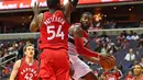 Aksi pemain Washington Wizards, John Wall (kanan) saat melewati hadangan pemain Toronto Raptors, Patrick Patterson #54 pada laga NBA Preseason di Verizon Center, Ssabtu (22/10/2016) WIB. (Mandatory Credit: Brad Mills-USA TODAY Sports)