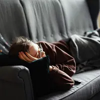 Ilustrasi sedang merasa malas, mager, rebahan. (Photo by Adrian Swancar on Unsplash)