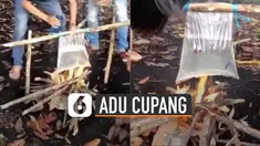 Beberapa pemuda sudah menyiapkan api yang menyala dan kantong plastik berisi air di atasnya.