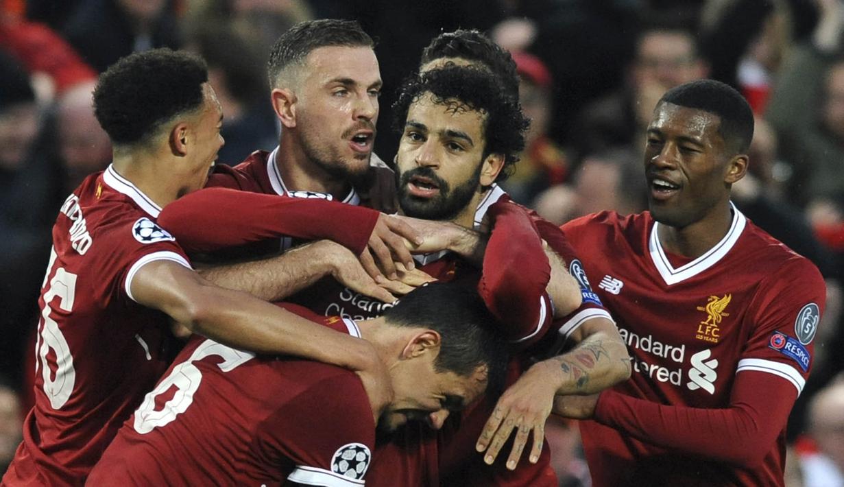 Para pemain Liverpool merayakan gol yang dicetak oleh Mohamed Salah ke gawang AS Roma pada leg pertama semifinal Liga Champions di Stadion Anfield, Selasa (24/4/2018). Liverpool menang 5-2 atas AS Roma. (AP/Rui Vieira)