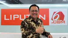 Ketua DPD Republik Indonesia Irman Gusman saat berkunjung ke Kantor Liputan6.com di SCTV Tower, Jakarta, Rabu (17/12/2014). (Liputan6.com/Johan Tallo) 