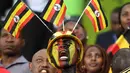 Seorang suporter dari uganda bersorak mendukung timnya saat berhadapan dengan Mesir di grup D Piala Afrika 2017 di Port-Gentil pada tanggal 21 Januari 2017. (AFP Photo/Justin Tallis)
