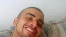 Sebuah foto tak bertanggal diambil dari akun media sosial Omar Mateen. Menurut aparat penegak hukum setempat, Omar sempat membeli senjata secara legal beberapa pekan sebelum penembakan dan memiliki izin kepemilikan senjata. (HANDOUT/MYSPACE.COM/AFP)