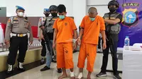 Pelaku pencurian uang pengusaha sawit di Kabupaten Kampar yang menyandang duta mafia karena pernah merampok di Malaysia. (Liputan6.com/M Syukur)