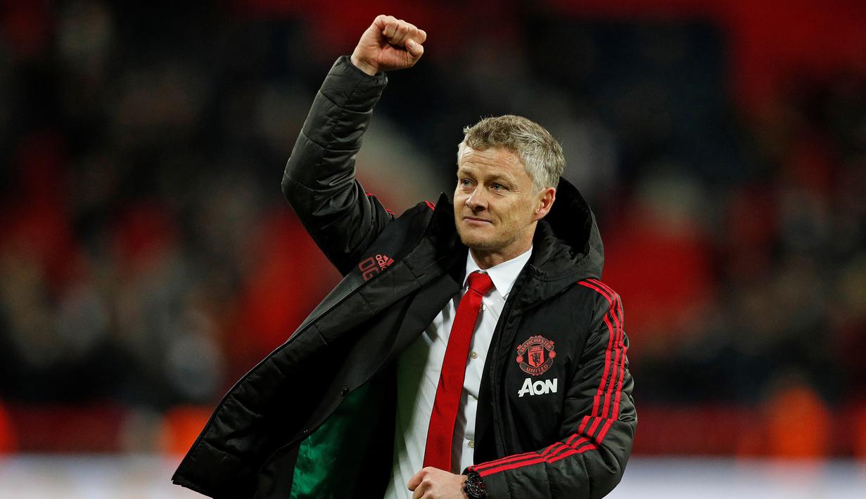 Ekspresi kemenangan Ole Gunnar Solskjaer pada laga lanjutan Premier League yang berlangsung di stadion Wembley, Inggris, Minggu (13/1). Man United menang atas Tottenham Hotspur 1-0. (AFP/Adrian Dennis)