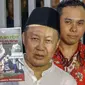 Mantan Kepala BPPN, Syafruddin Arsyad Temenggung menunjukkan buku yang ditulisnya saat meninggalkan Rutan KPK, Jakarta, Selasa (7/9/2019). Sebelumnya, Majelis Hakim Pengadilan Tipikor Jakarta menjatuhi vonis 13 tahun penjara dan denda Rp700 juta. (Liputan6.com/Helmi Fithriansyah)