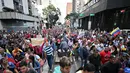 Bahkan, putra Nicolas Maduro yang merupakan anggota Kongres menyerukan pada Minggu 4 Januari 2026 agar warga Venezuela turun ke jalan setelah ayahnya ditangkap oleh pasukan AS dan dipindahkan ke penjara New York. Tampak dalam foto, pendukung mantan Presiden Venezuela, Nicolas Maduro, saat menggelar aksi unjuk rasa di Caracas pada Minggu 4 Januari 2026. (Juan BARRETO/AFP)