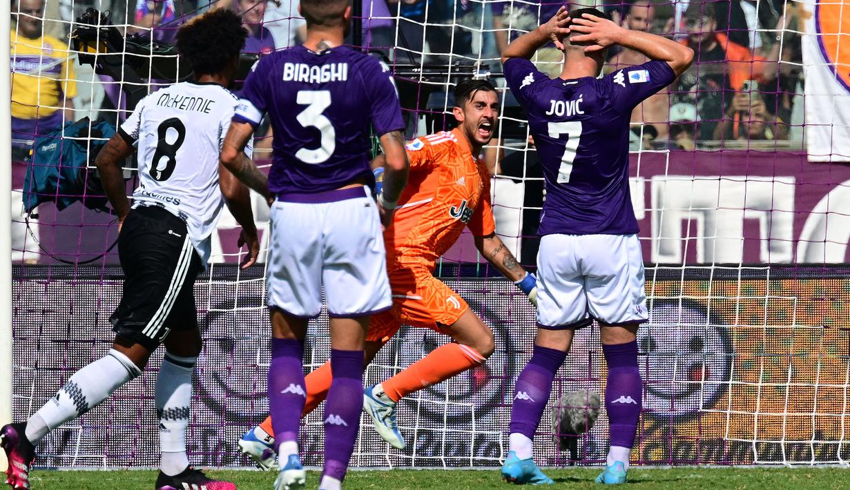 <p>Fiorentina hanya puas memetik poin satu usai bermain imbang dengan Juventus pada laga pekan kelima Liga Italia di Stadion Artemio-Franchi, Sabtu (03/09/2022) malam WIB. (AFP/Vincenzo Pinto)</p>