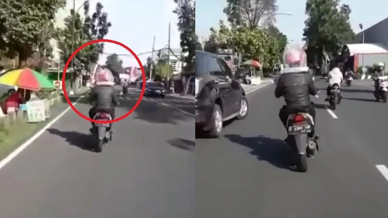 pengendara motor lapisi helmnya dengan plastik