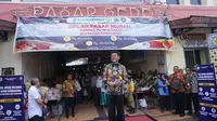 Menteri Pertanian Syahrul Yasin Limpo ketika sedang membuka operasi pasar murah bawang putih dan cabai di Pasar Gede Solo, Kamis (13/2).(Liputan6.com/Fajar Abrori)