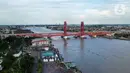 Foto udara menunjukkan Jembatan Ampera, Palembang, Sumatera Selatan, Minggu (12/3/2023). Adapun dari jumlah tersebut, kunjungan wisatawan didominasi wisatawan nusantara. (Liputan6.com/Herman Zakharia)