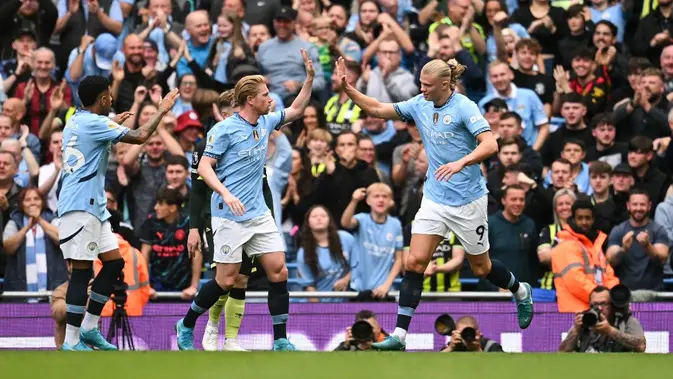 <p>Manchester City meraih kemenangan 2-1 atas Brentford pada laga pekan keempat Premier League musim ini di Stadion Etihad, Sabtu (14/9/2024) malam WIB. (AFP/Oli Scarff)</p>