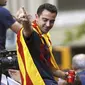 Xavi Hernandez saat melakukan selebrasi usai membawa Barcelona menjuarai Liga Champions 2014-2015. Xavi menuduh kalangan media tak adil dalam pemberitaan terkait masalah pajak Lionel Messi.  (EPA/Alejandro Garcia)