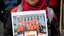 Para buruh juga menyuarakan penghapusan sistem kerja Outsourcing, upah murah, dan Pemutusan Hubungan Kerja (PHK). (BAY ISMOYO/AFP)
