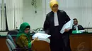 Pengacara Susi Tur Andayani menjalani sidang terkait kasus dugaan suap pengurusan sengketa pilkada di Mahkamah Konstitusi (MK). Senin (19/5/14) (Liputan6.com/Miftahul Hayat)