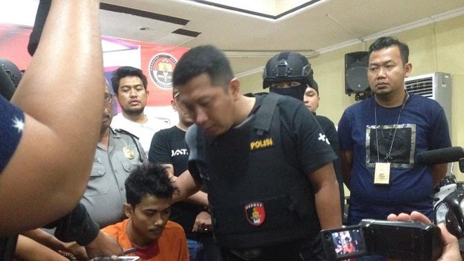 Zulkifli, anggota komplotan pembunuh sadis satu keluarga di Makassar akhir tertangkap (Liputan6.com/ Eka Hakim)