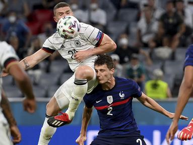 Bermain di kandang lawan, Timnas Prancis mendapat tekananan sejak bola digulirkan. Meski begitu, solidnya lini belakang tim asuhan Didier Deschamps tersebut membuat serangan yang dibangun Jerman selalu kandas. (Foto: AP/Pool/Matthias Hangst)