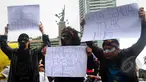 Mahasiswa Institut Kesenian Jakarta dan Gerakan Islam Anti Kekerasan menggelar aksi damai menolak ISIS di Bundaran HI, Jakarta, Minggu (8/3/2015). (Liputan6.com/Yoppy Renato)