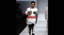 Gambar Karikatur hadir cukup intens pada karya-karya Monstore di Jakarta Fashion Week 2015, Sabtu (1/11/2014). (Liputan6.com/Panji Diksana)