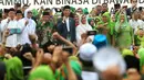 Presiden Joko Widodo bersama Ibu Negara Iriana, Menag Lukman Hakim Saifuddin, Ketum PBNU Said Aqil Siradj, Ketum PP Muslimat NU Khofifah Indar Parawansa saat menghadiri Harlah ke-73 Muslimat NU di SUGBK, Jakarta, Minggu (27/1). (Liputan6.com/Johan Tallo)