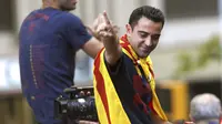 Xavi Hernandez saat melakukan selebrasi usai membawa Barcelona menjuarai Liga Champions 2014-2015. Xavi menuduh kalangan media tak adil dalam pemberitaan terkait masalah pajak Lionel Messi.  (EPA/Alejandro Garcia)