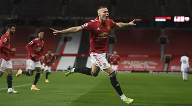 Gelandang Manchester United (MU) Scott McTominay berselebrasi usai mencetak gol ke gawang Leeds United dalam lanjutan Liga Inggris di stadion Old Trafford, Senin (21/12/2020) dinihari WIB. Scott McTominay cetak sejarah dengan dua gol dalam kurun waktu tiga menit menit. (Michael Regan/Pool via AP)