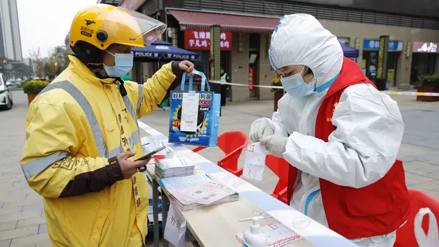 FOTO: Aksi Komunitas di China Antar Kebutuhan Warga yang Dikarantina Akibat COVID-19