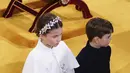 Saat memasuki gereja, Pangeran Louis dan Putri Charlotte berjalan di belakang Pangeran William dan Kate Middleton. (Yui Mok, Pool via AP)
