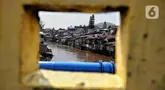 Suasana permukiman padat penduduk di bantaran Sungai Ciliwung, kawasan Manggarai, Jakarta, Rabu (14/5/2025). (Liputan6.com/Angga Yuniar)